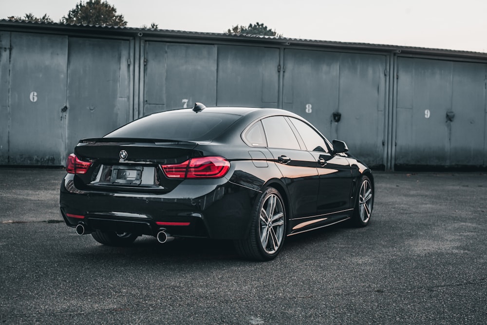 a black car parked in a parking lot