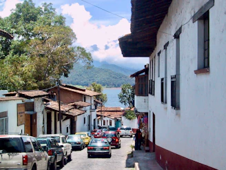a street with cars parked on both sides of it