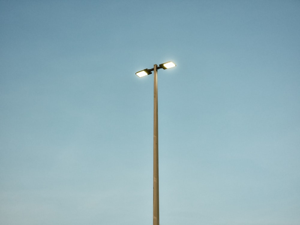 a street light with two lights on top of it