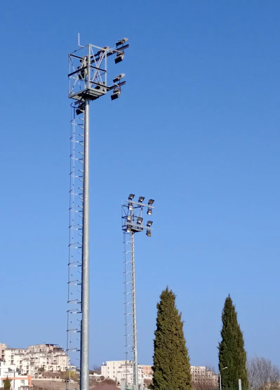 a tall metal pole with a bunch of lights on top of it
