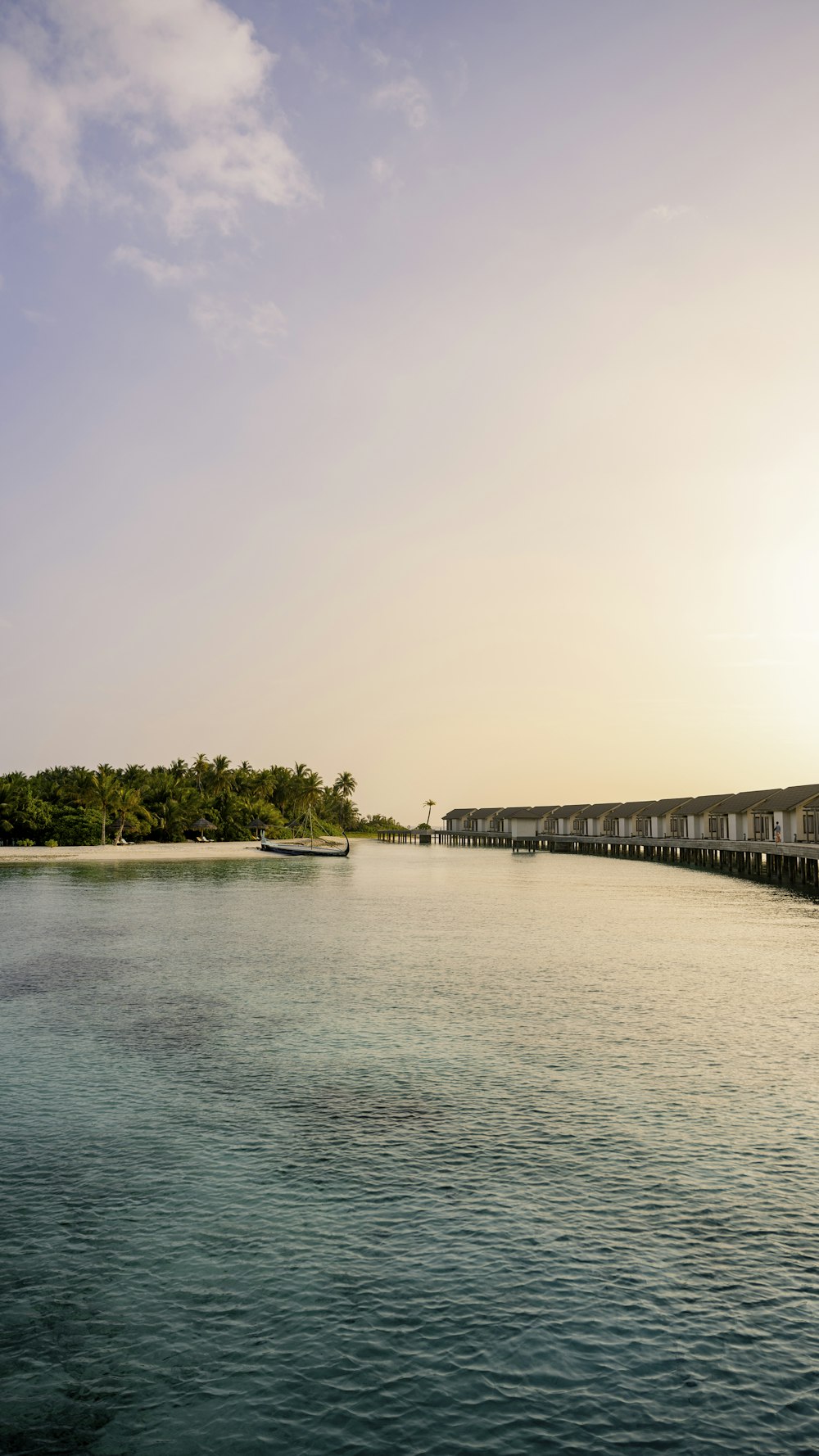 a body of water with a boat in the distance