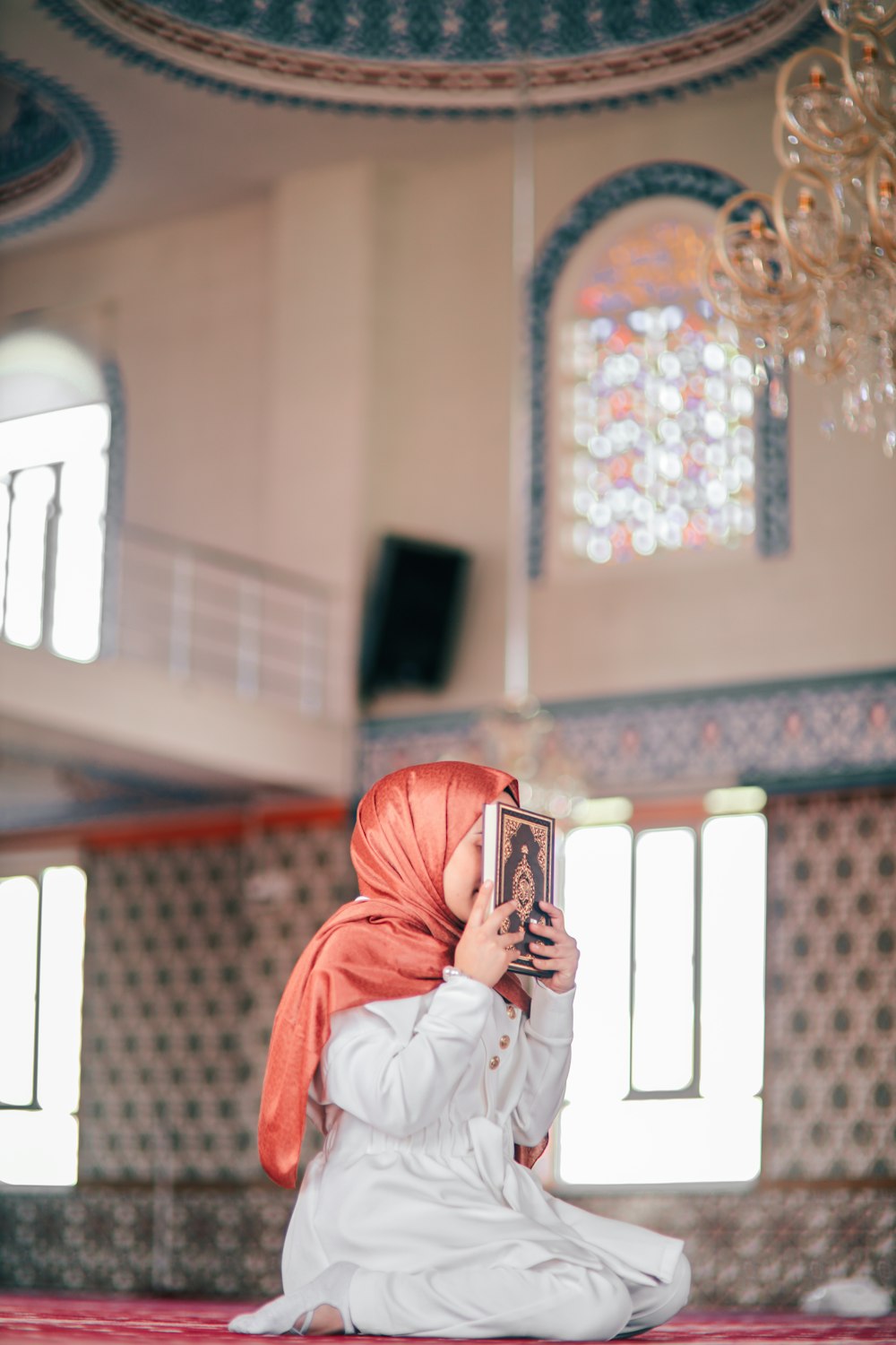 a woman sitting on the floor of a building