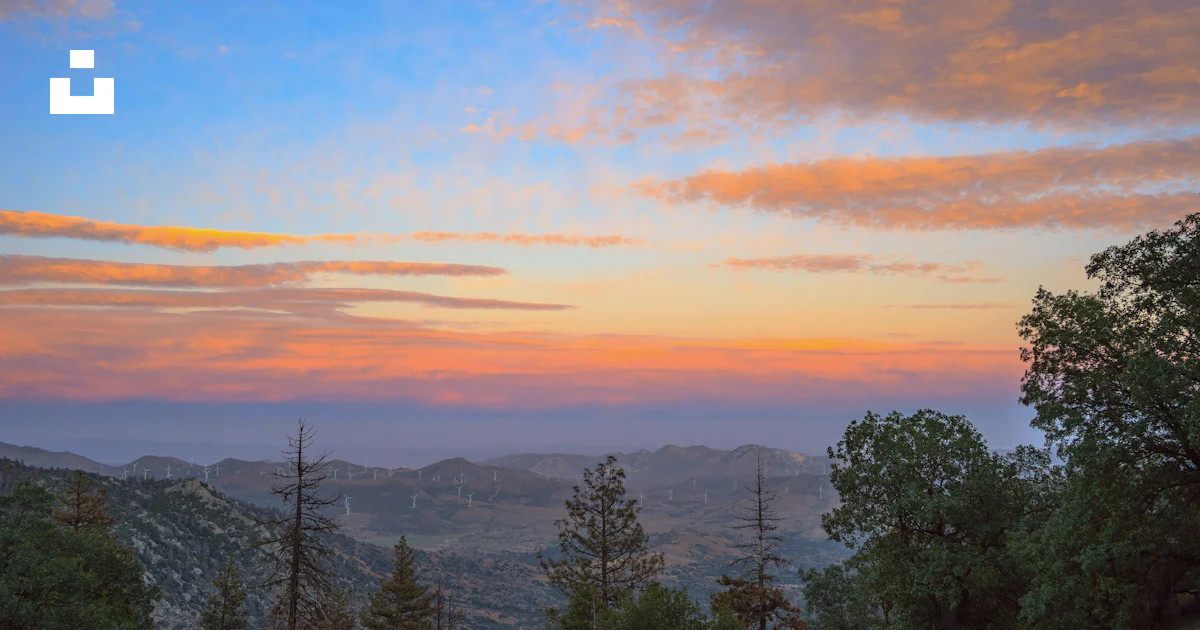 A sunset view of the mountains and trees photo – Free Ridgeline Image ...
