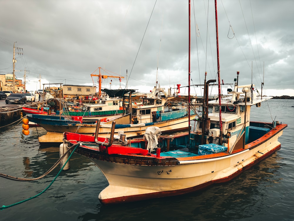 a group of boats that are sitting in the water