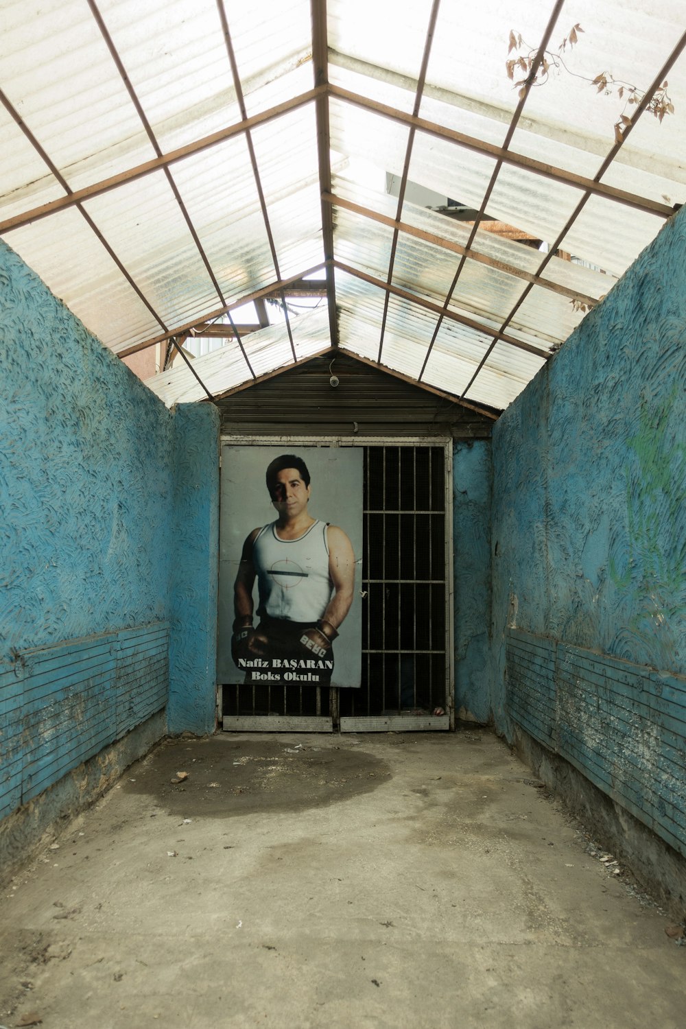 a jail cell with a poster of a woman behind bars