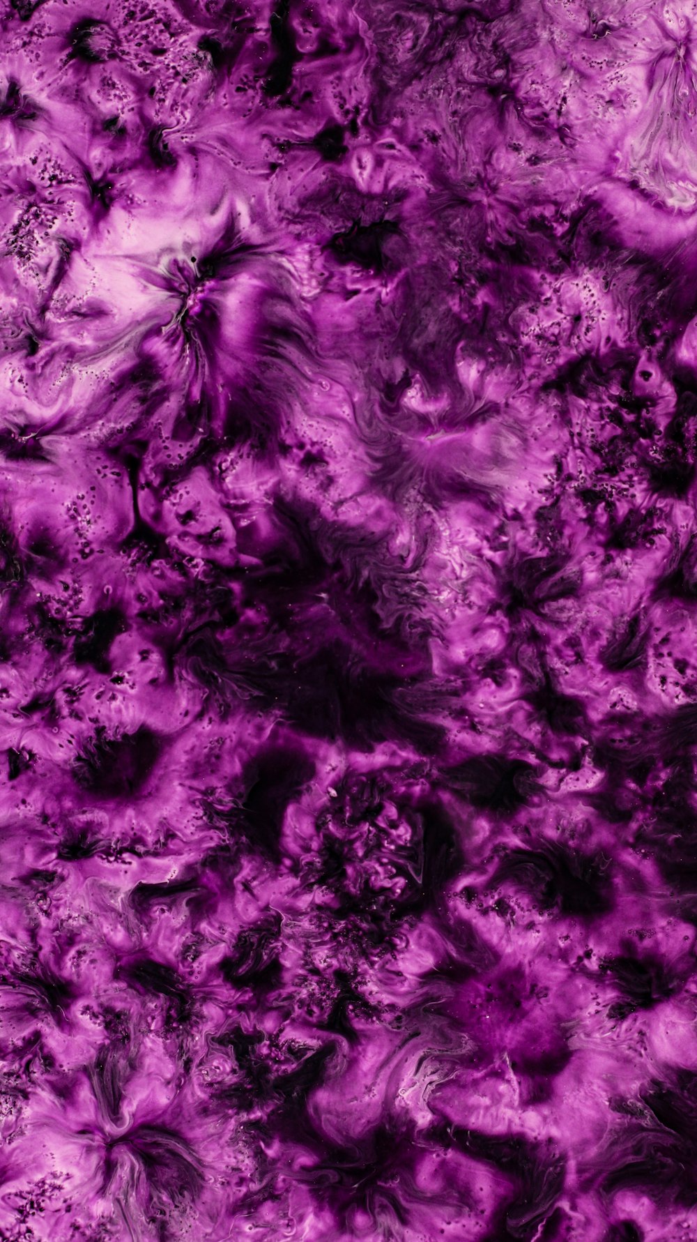 a purple background with black and white swirls