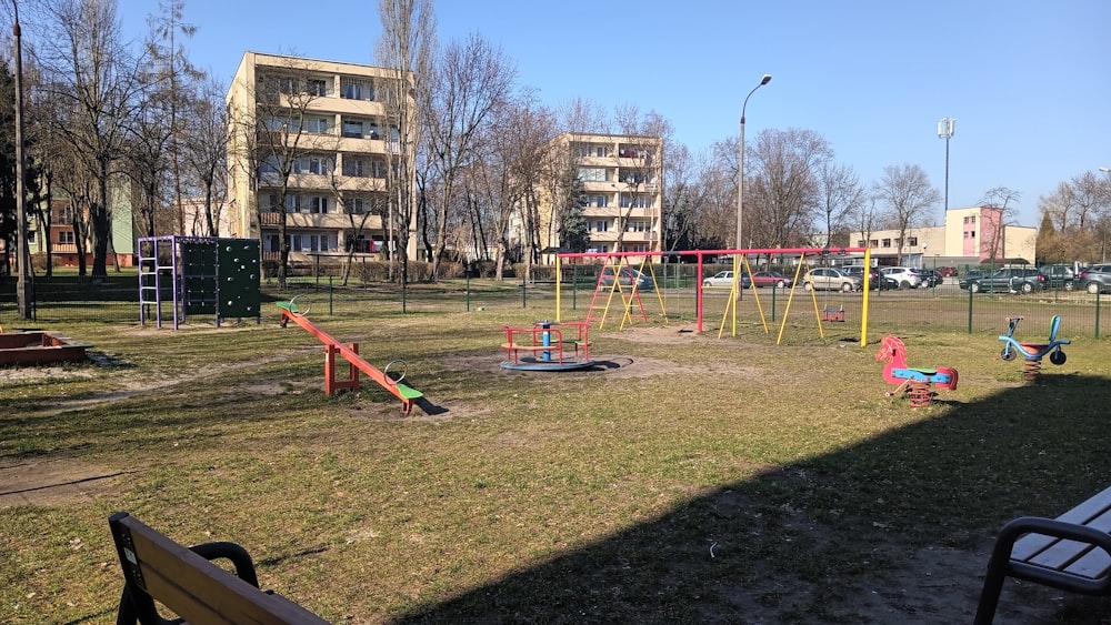 a park with swings, swings, and a playground