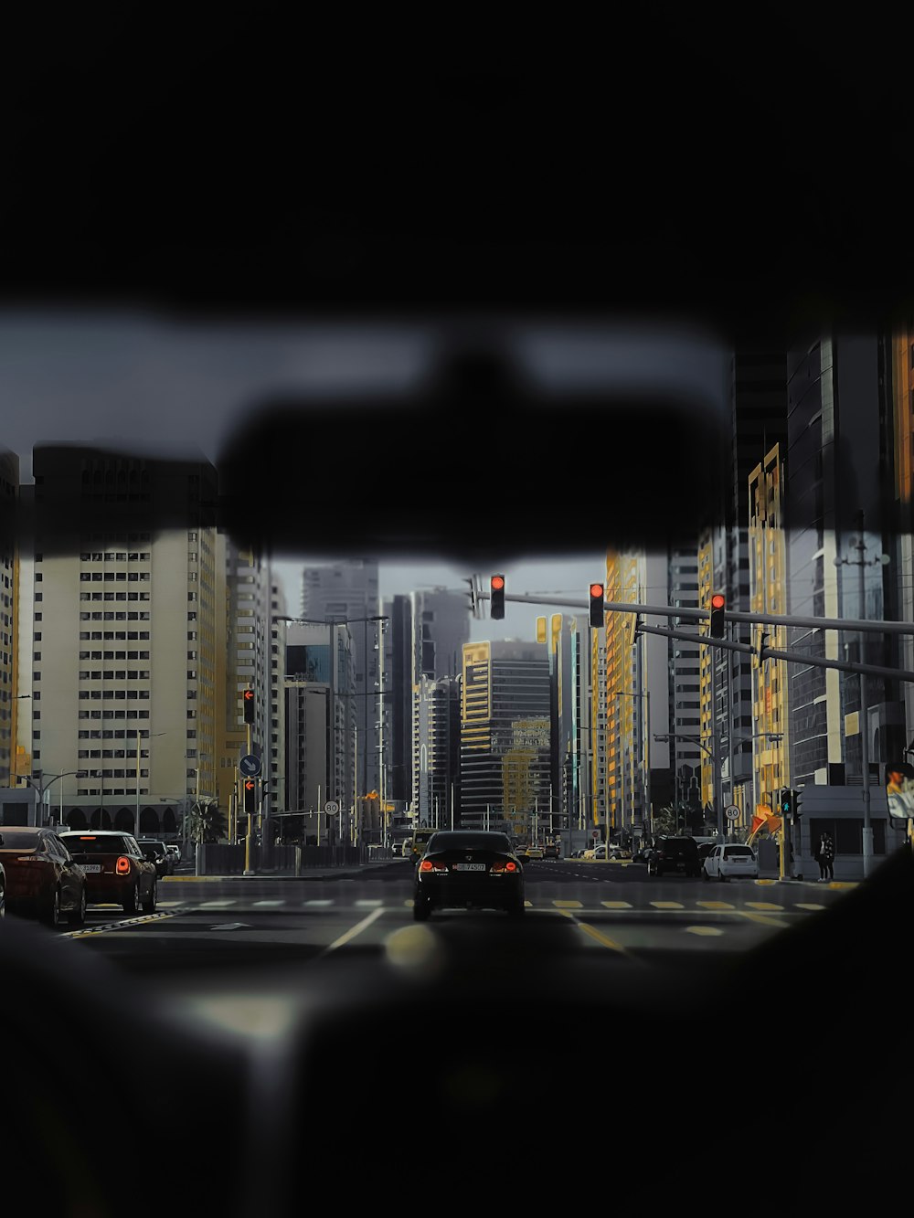 a view of a city from inside a vehicle