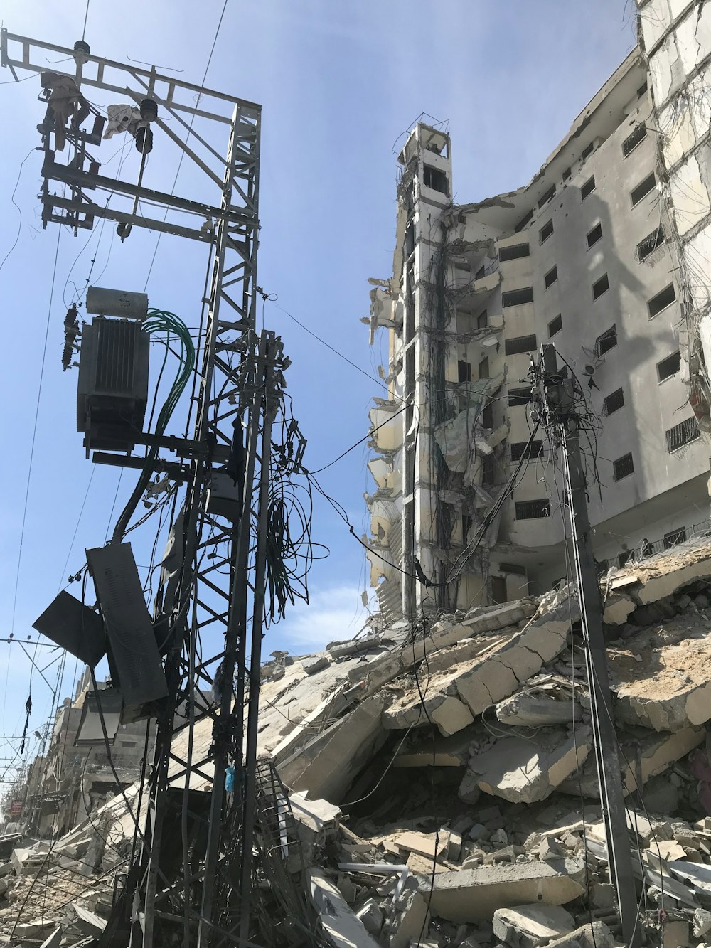 a very tall building with a bunch of wires on top of it