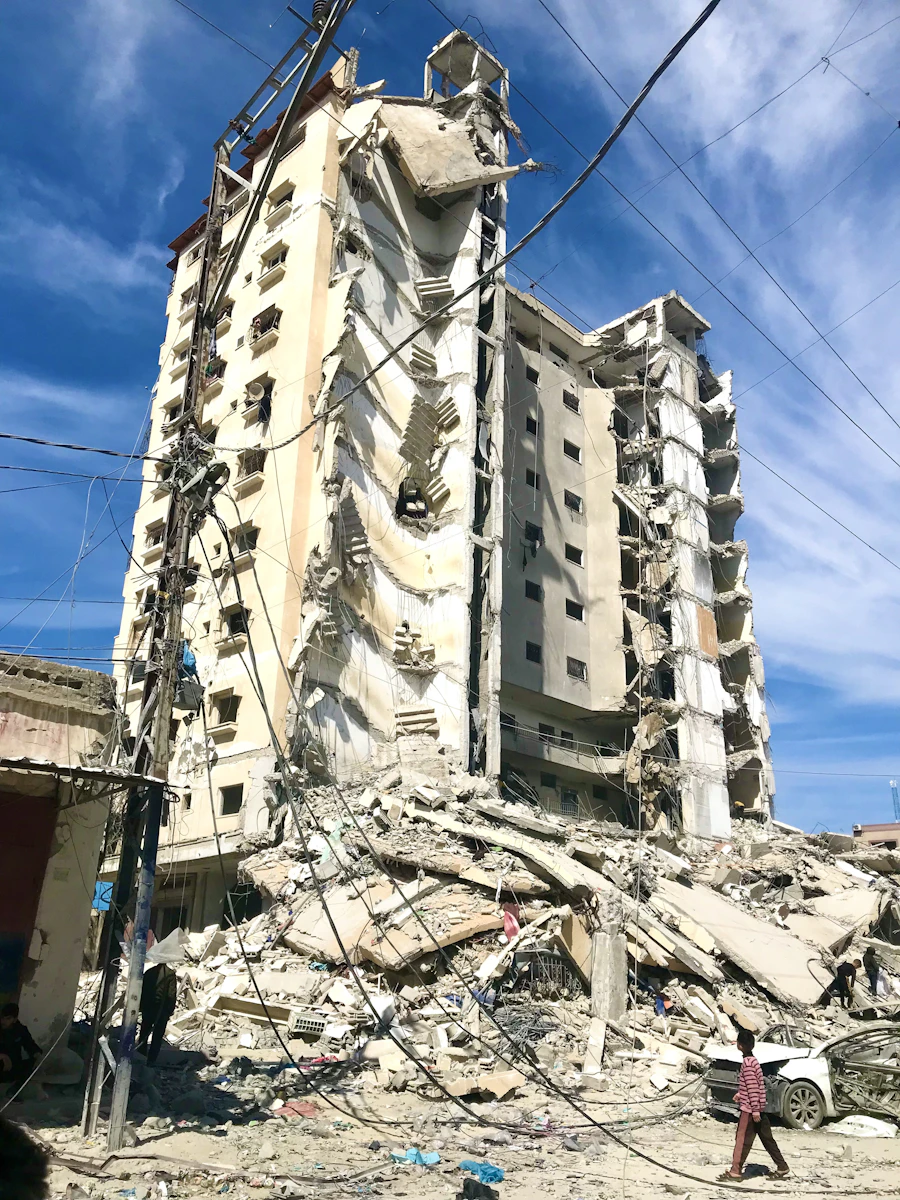A building destroyed in a disaster, with rubble and exposed structure