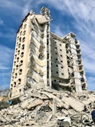 a very large building that has a bunch of rubble on it