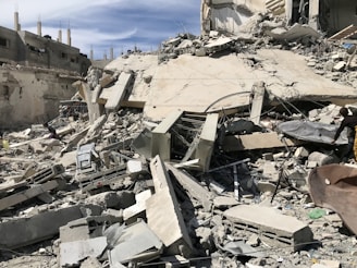 a pile of rubble next to a building