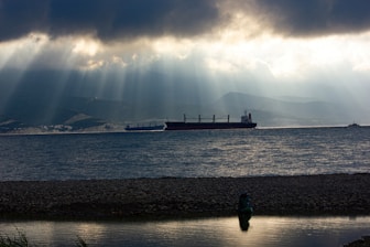 a large boat floating on top of a large body of water