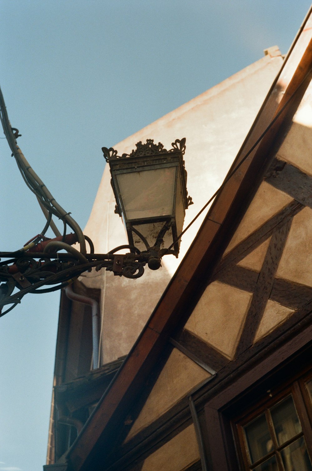 a street light hanging from the side of a building