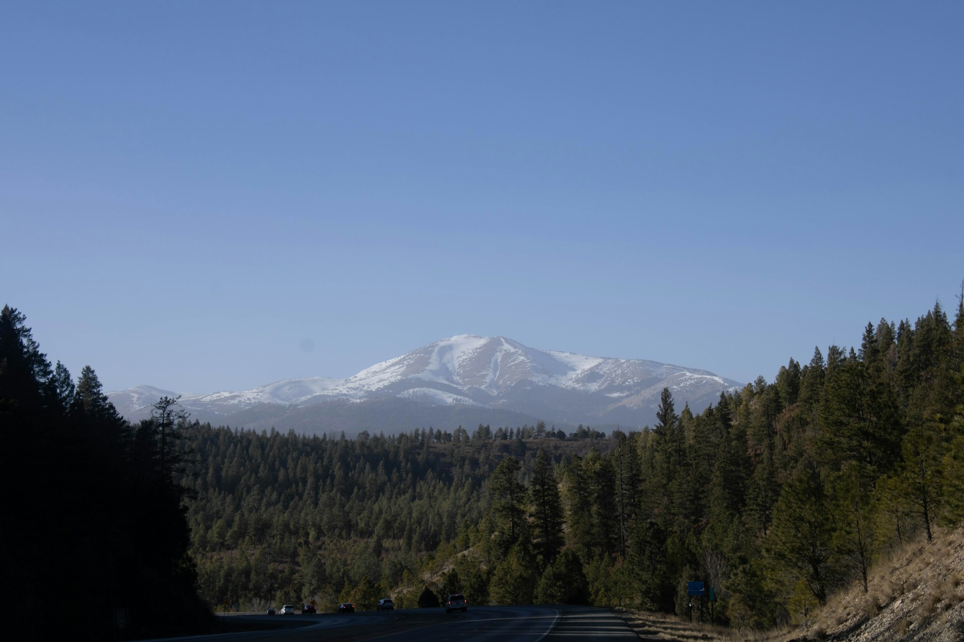 a road with a mountain in the background