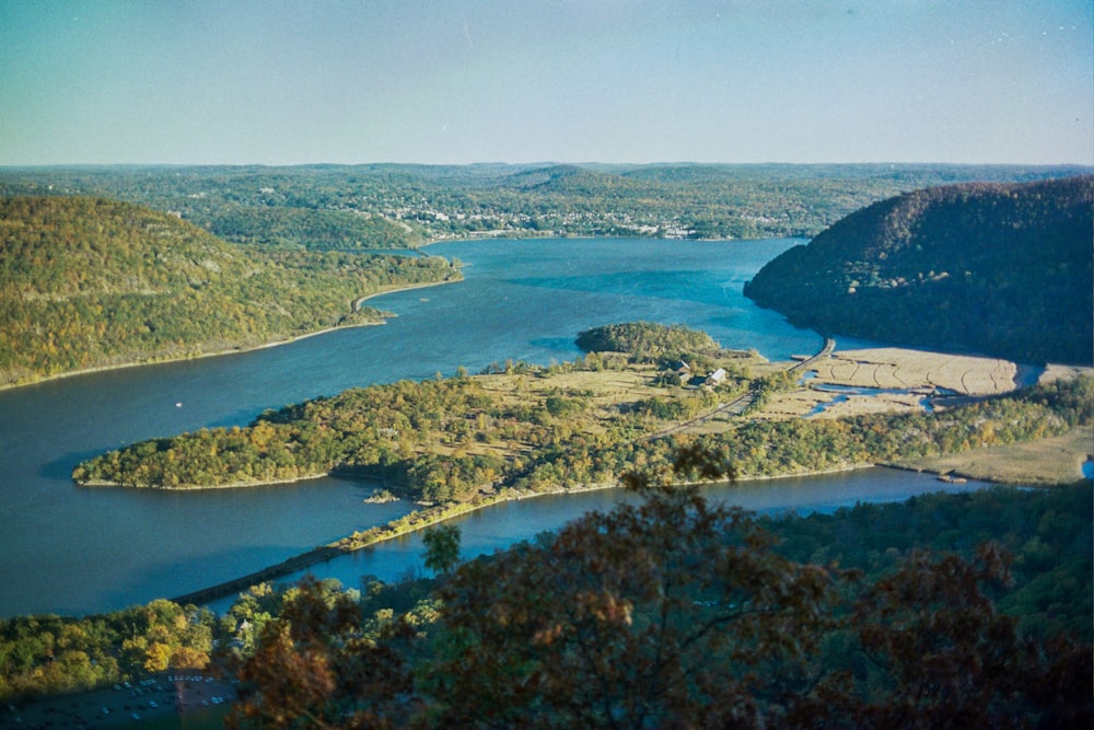 an aerial view of a lake surrounded by trees