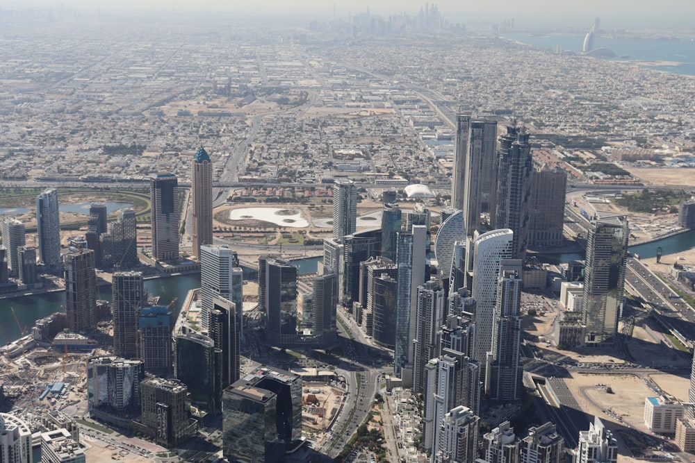 an aerial view of a city with tall buildings