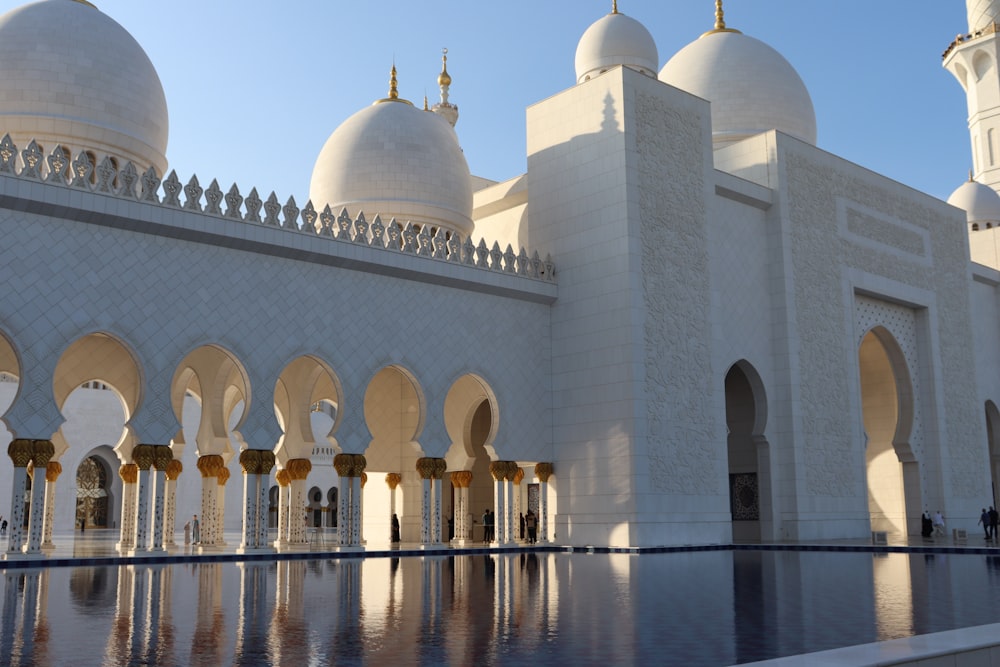 a large white building with many arches and domes