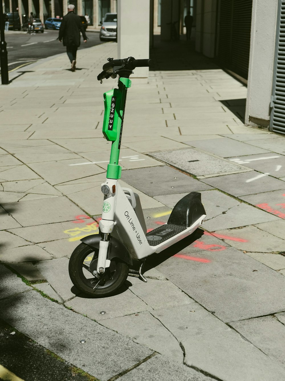 a scooter is parked on the side of the street