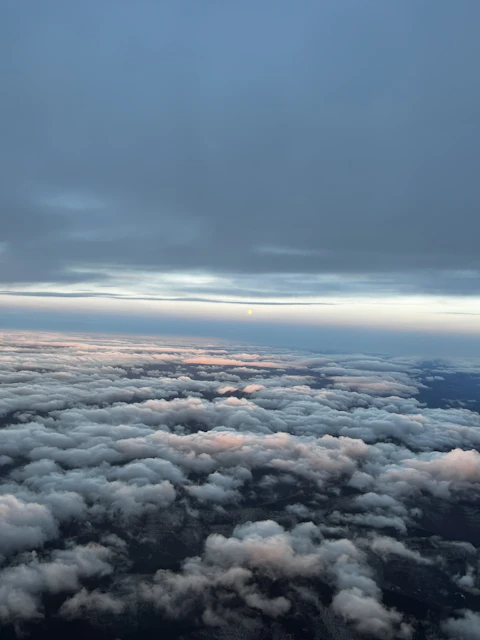 View from airplane window at sunset