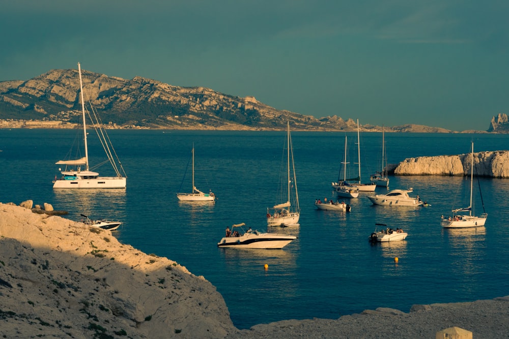 a group of boats floating on top of a body of water