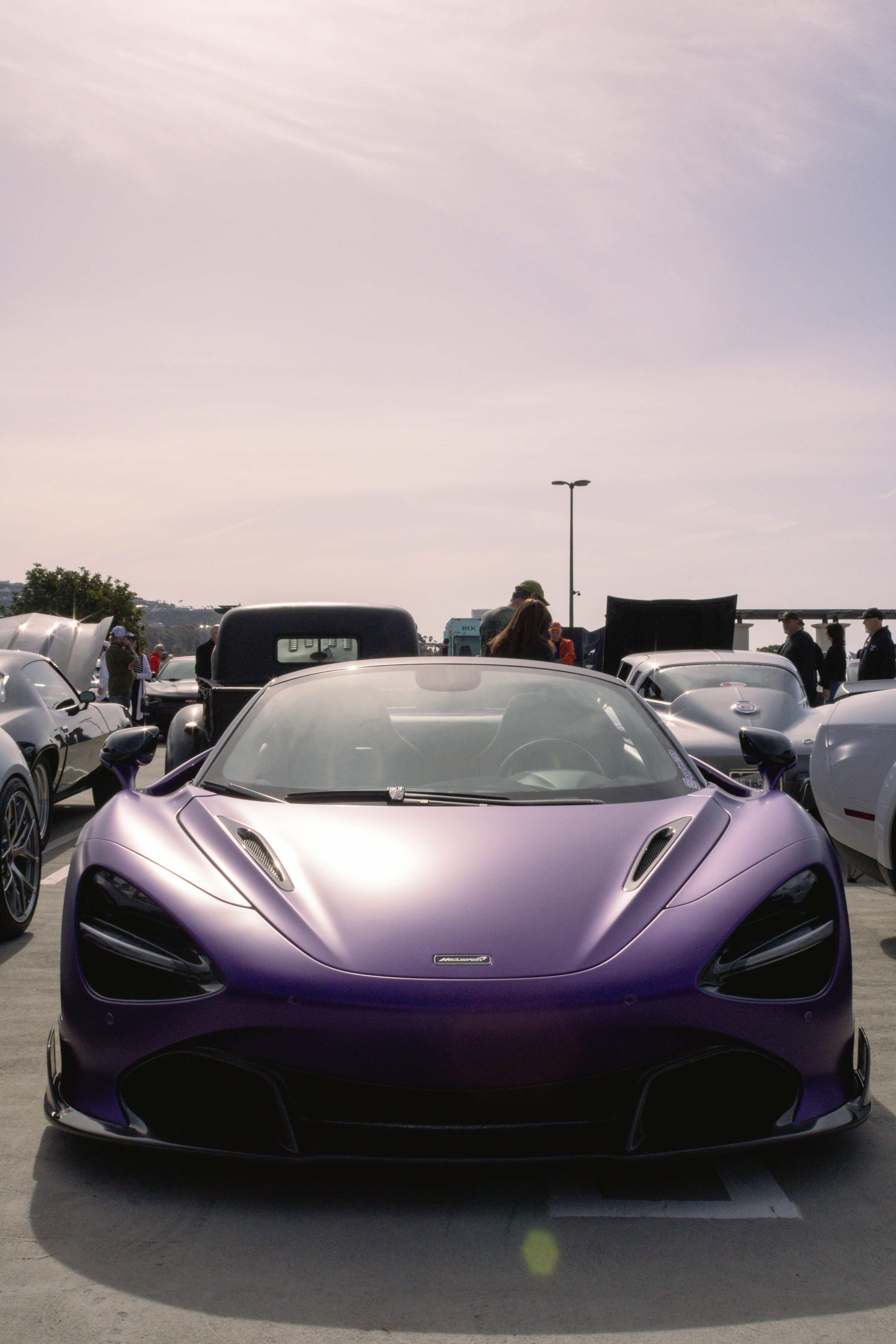 a purple sports car parked in a parking lot