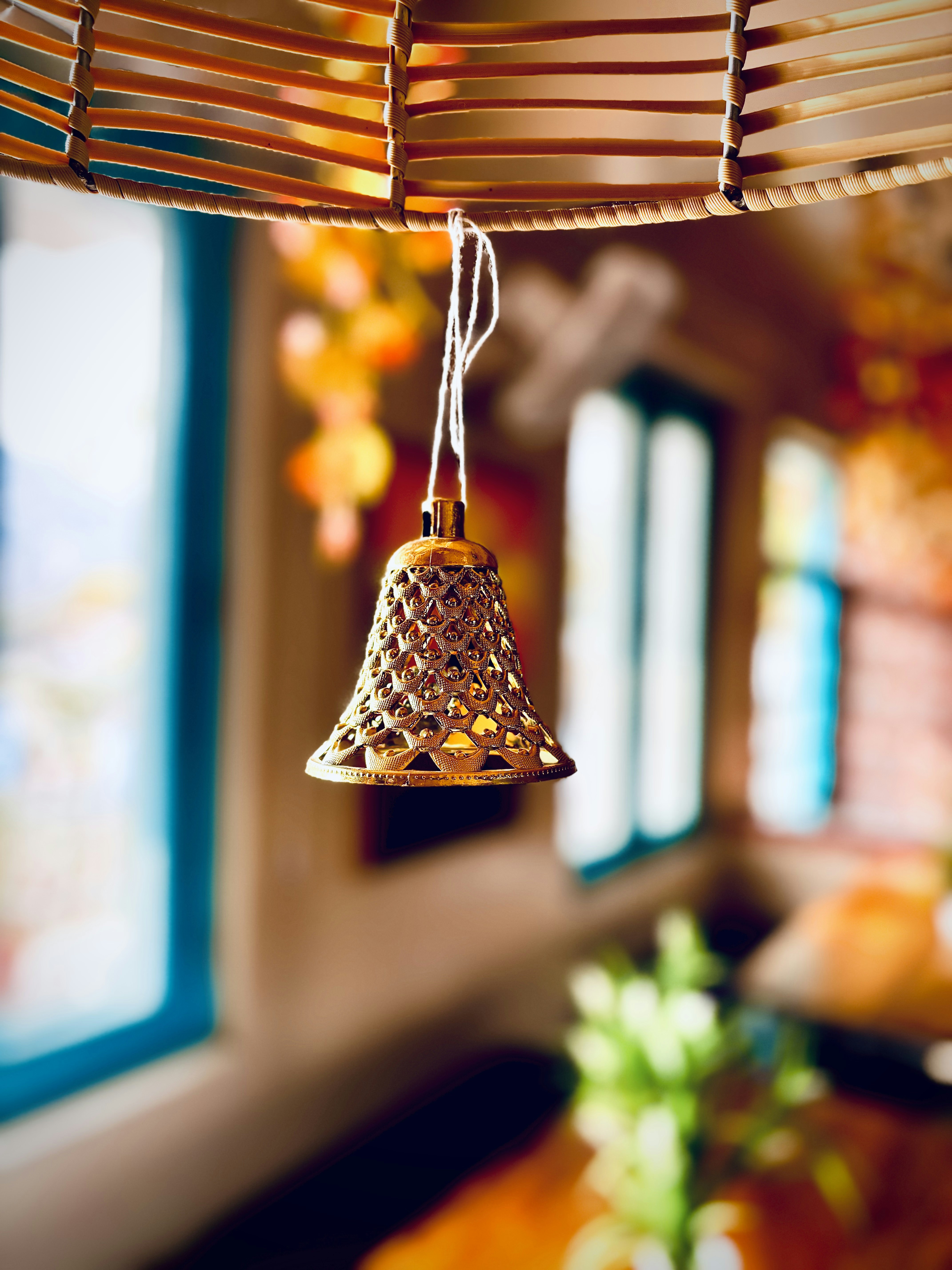 a close up of a bell hanging from a ceiling