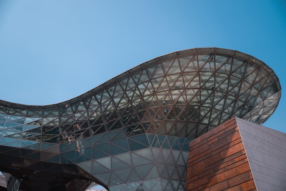 a large building with a curved roof on top of it