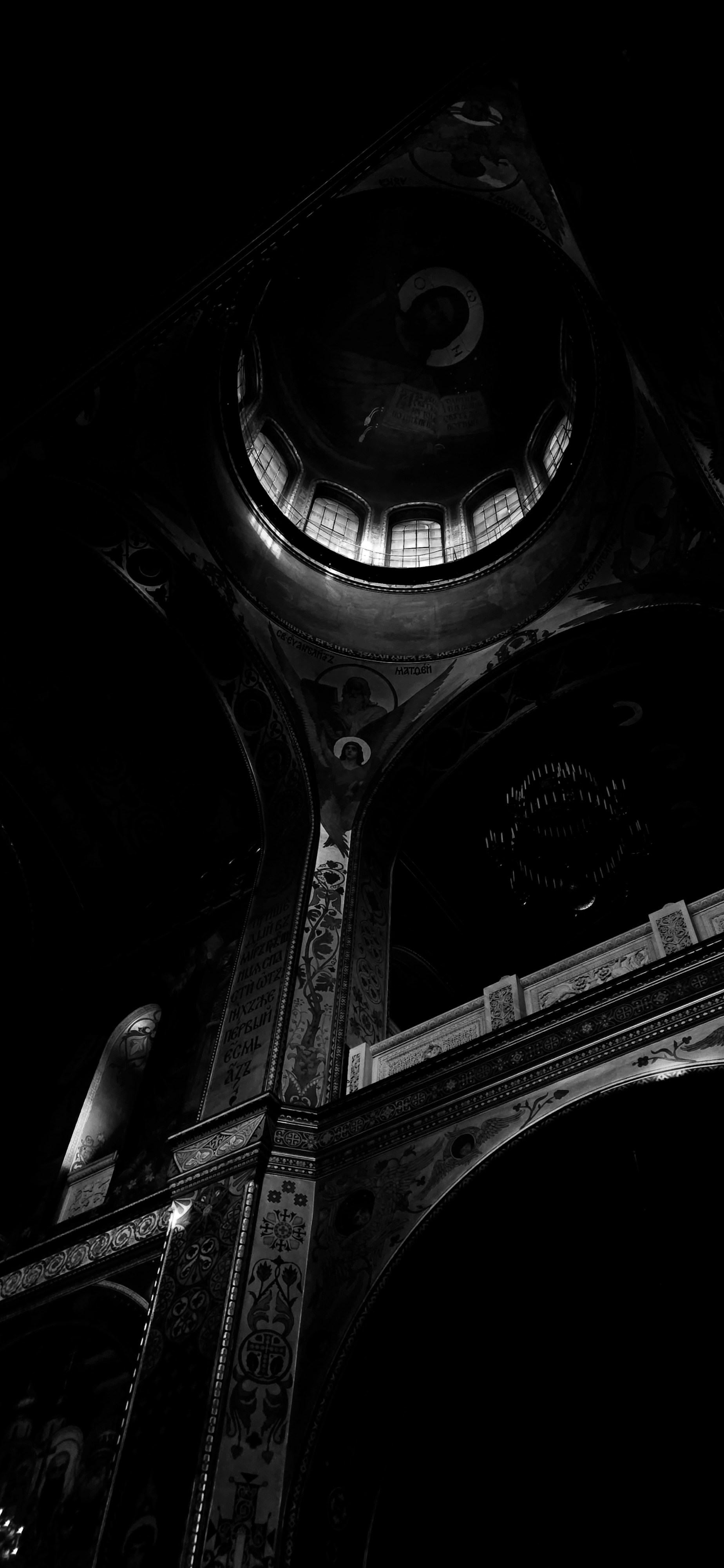 a black and white photo of a clock tower