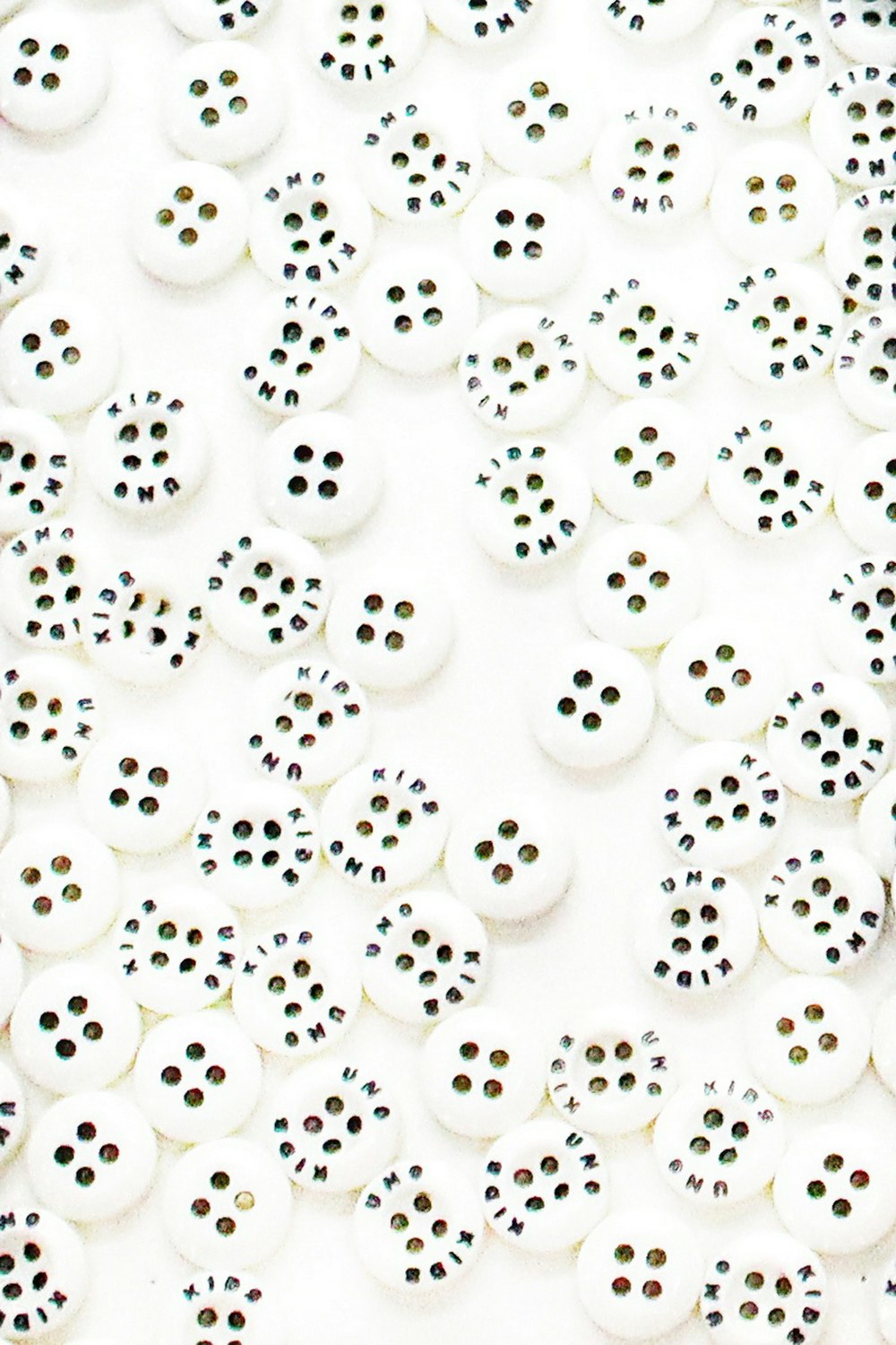 a group of buttons sitting on top of a white surface
