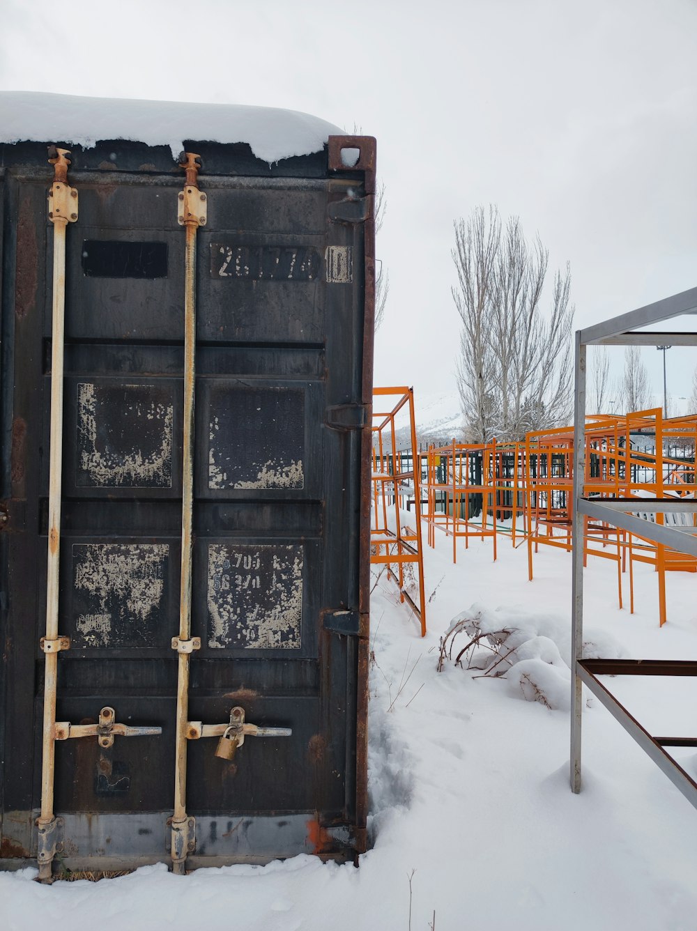 a large metal container sitting in the snow