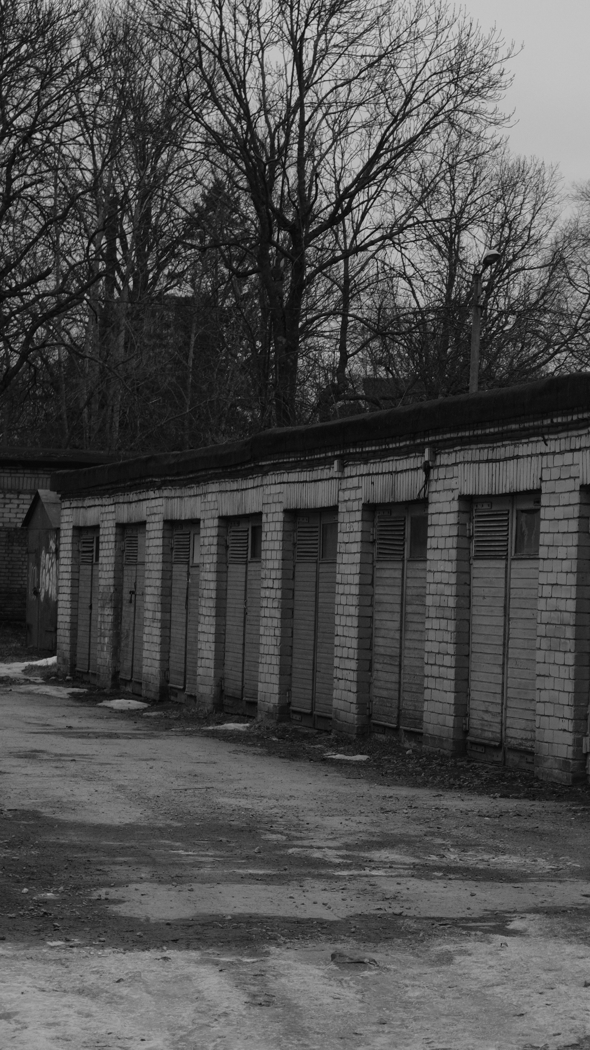 a black and white photo of an abandoned building