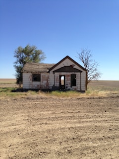 an old run down house in the middle of nowhere