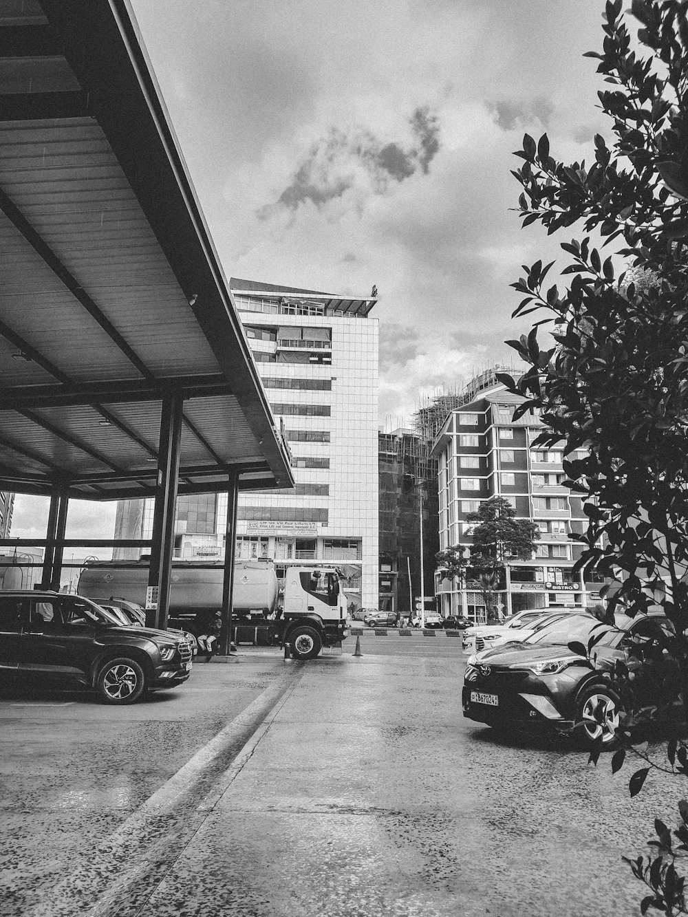 a black and white photo of a parking lot