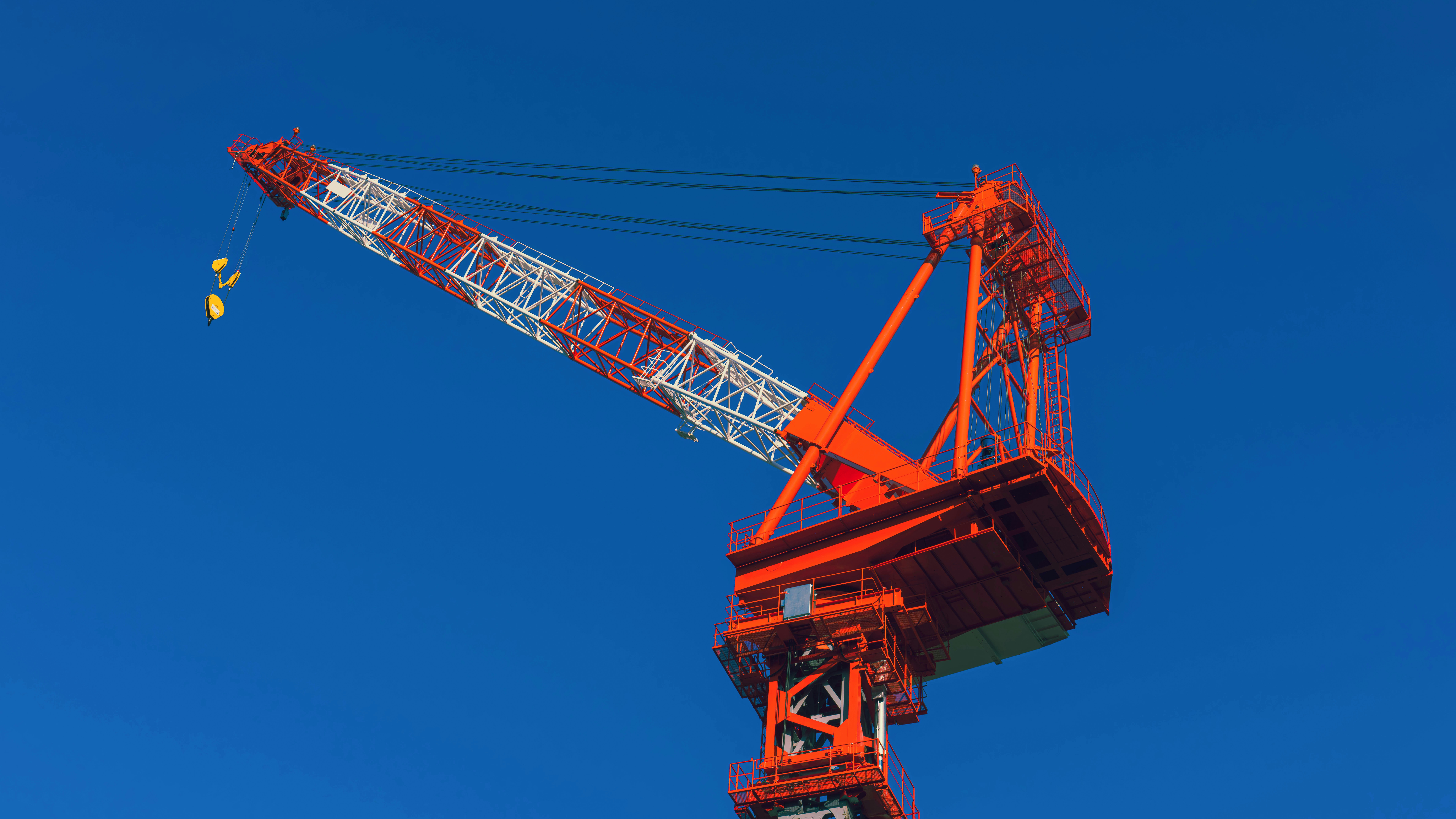 a large crane is on top of a building