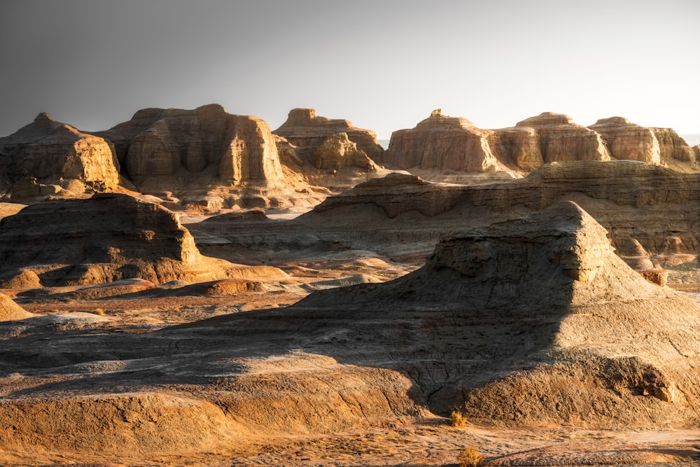 a desert landscape with rocks and hills in the background