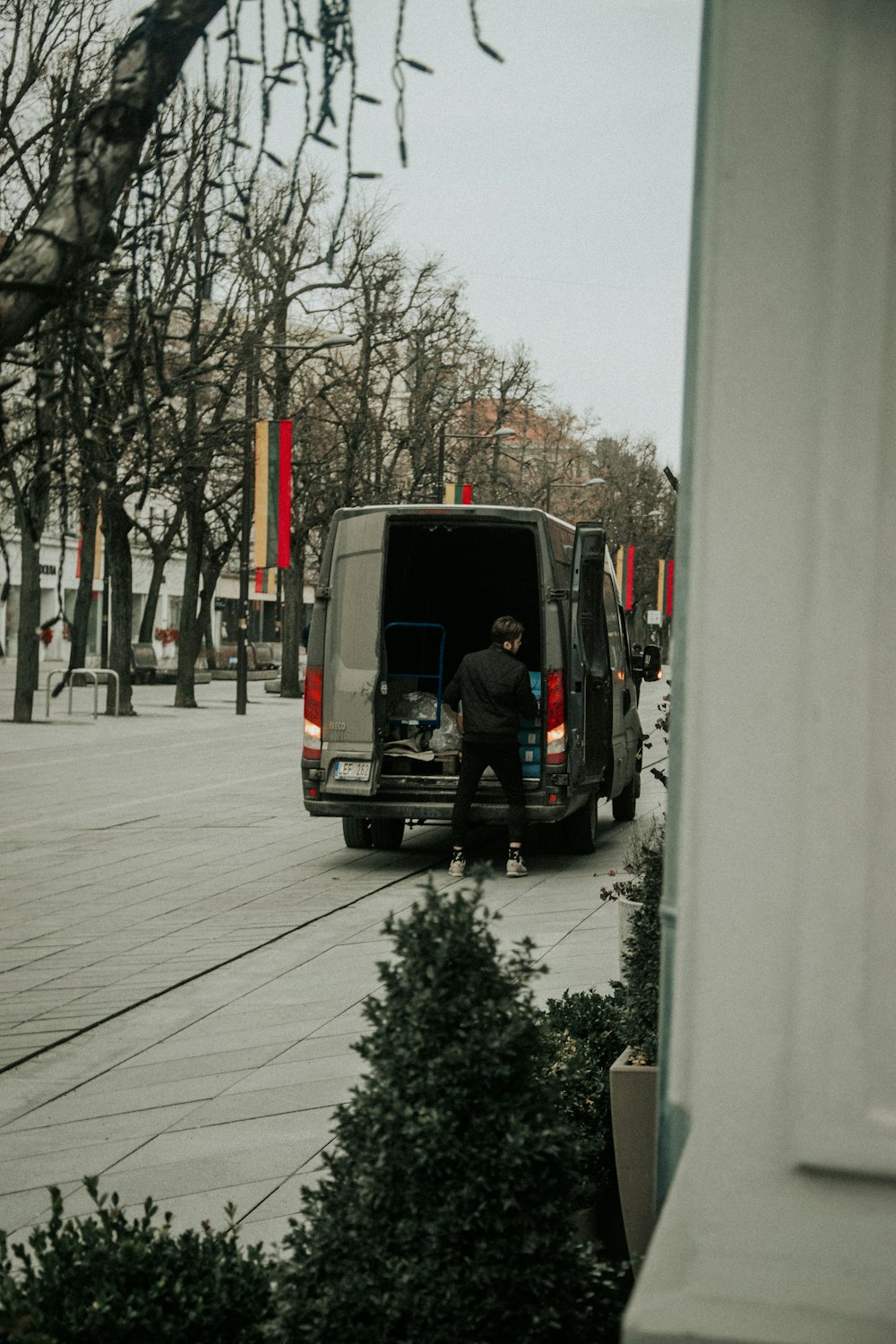 a man sitting in the back of a van