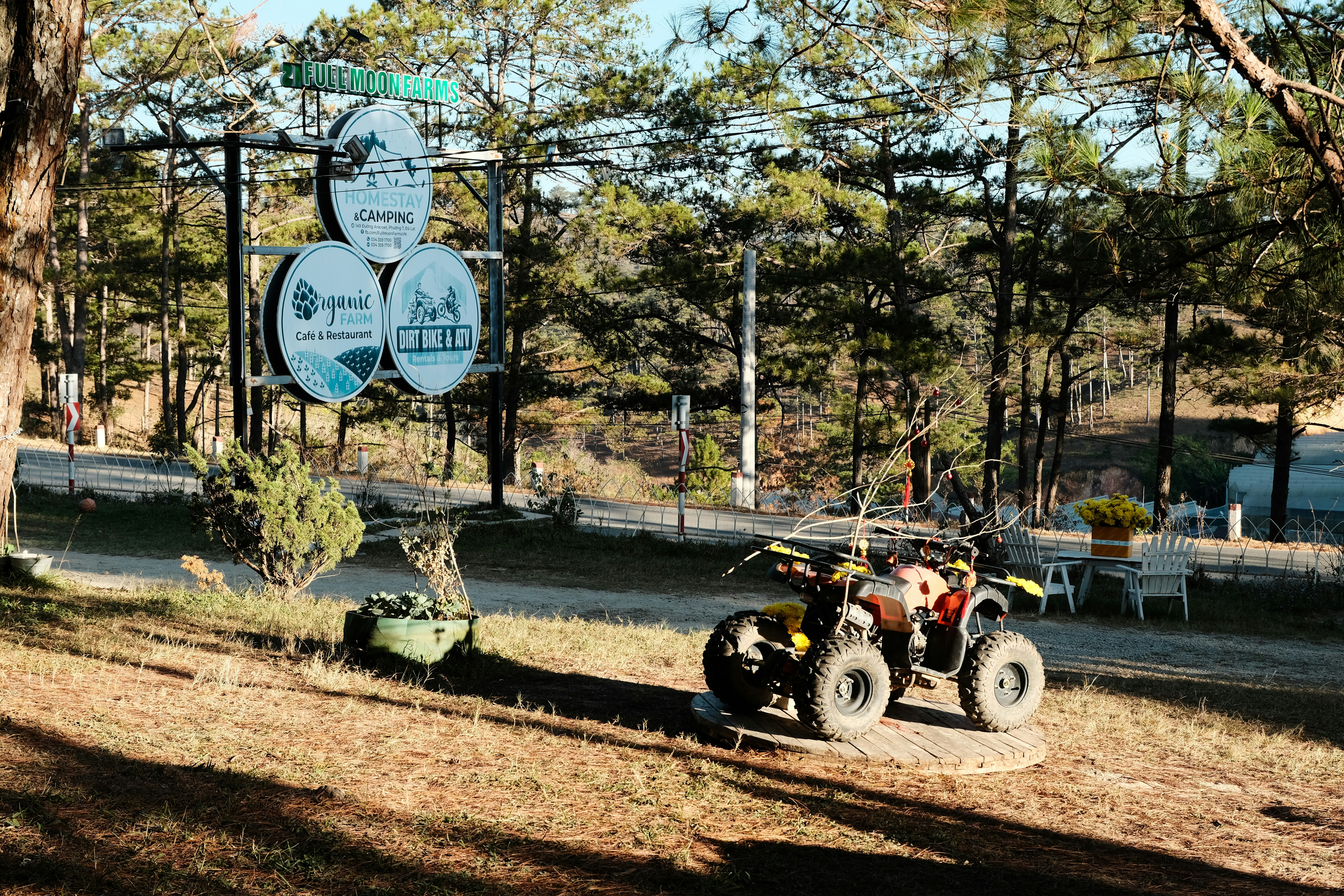 a person riding a four wheeler on a dirt road