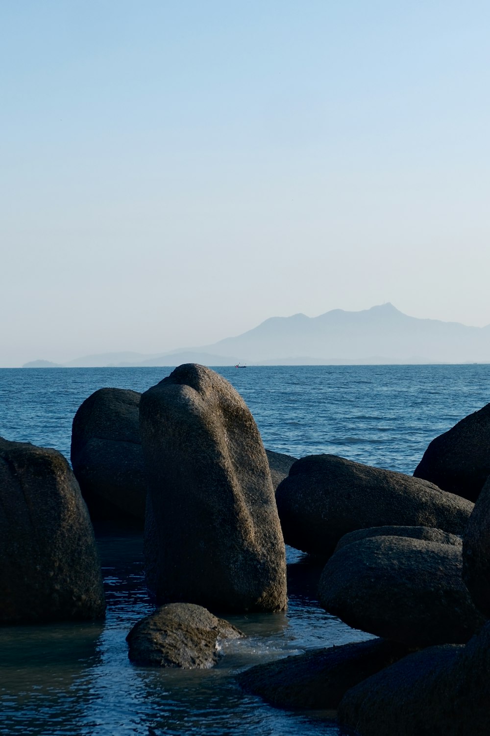 a large body of water surrounded by large rocks