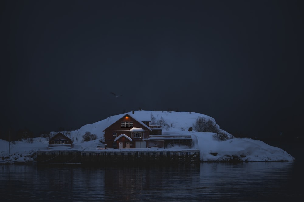 a house on a small island covered in snow