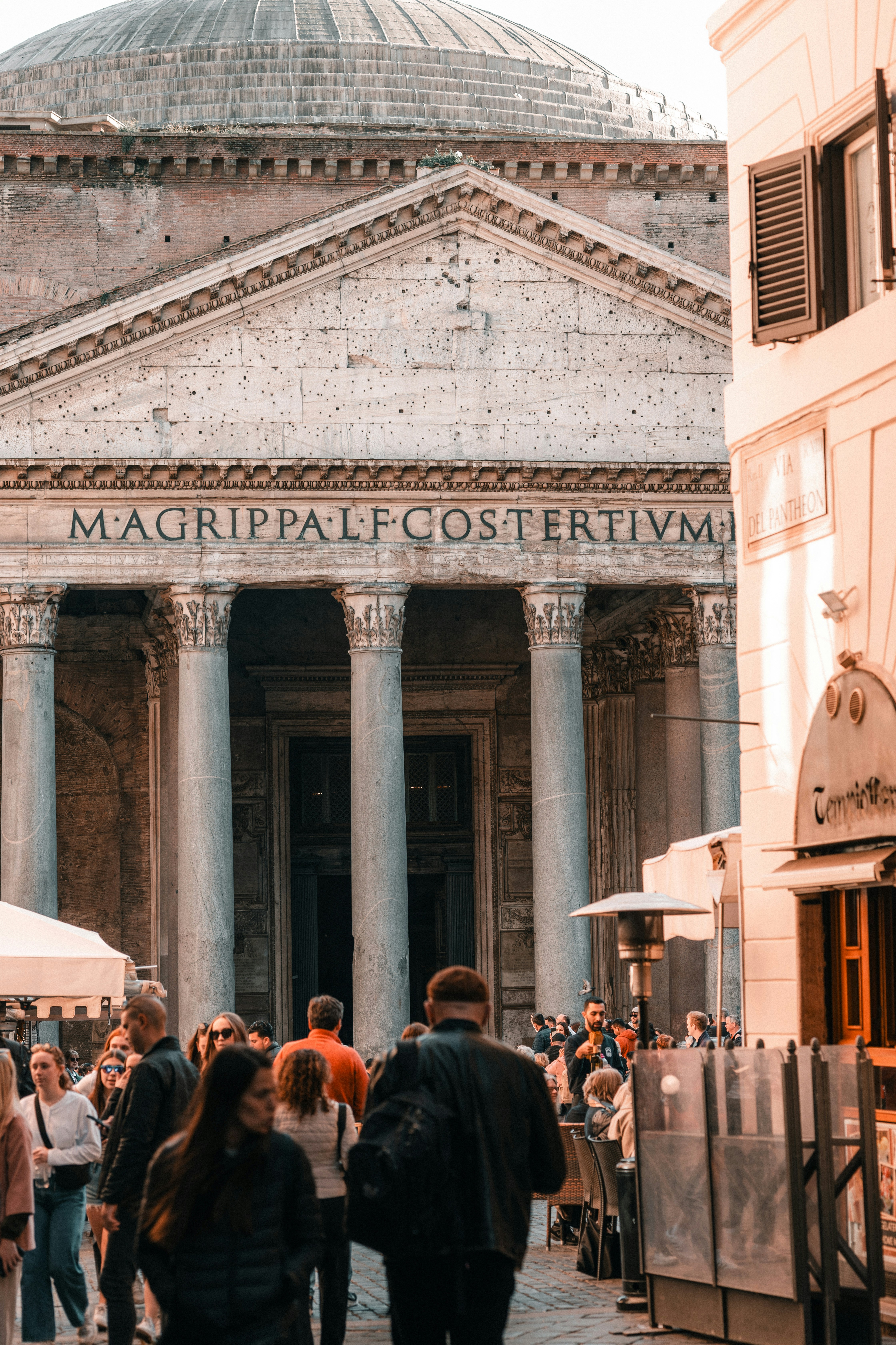 A group of people walking in front of a building photo – Free Roma ...