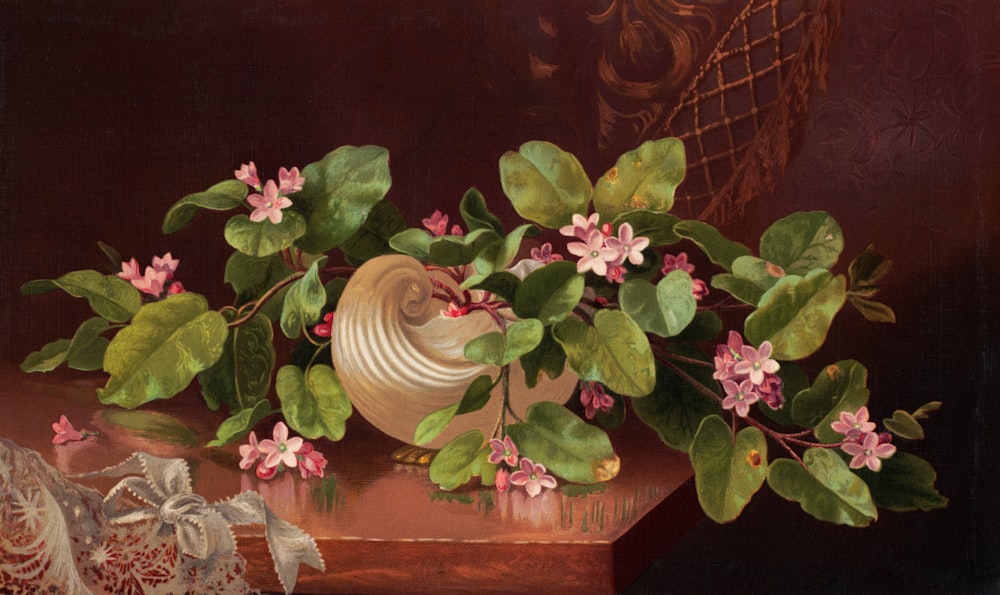 a painting of pink flowers in a vase