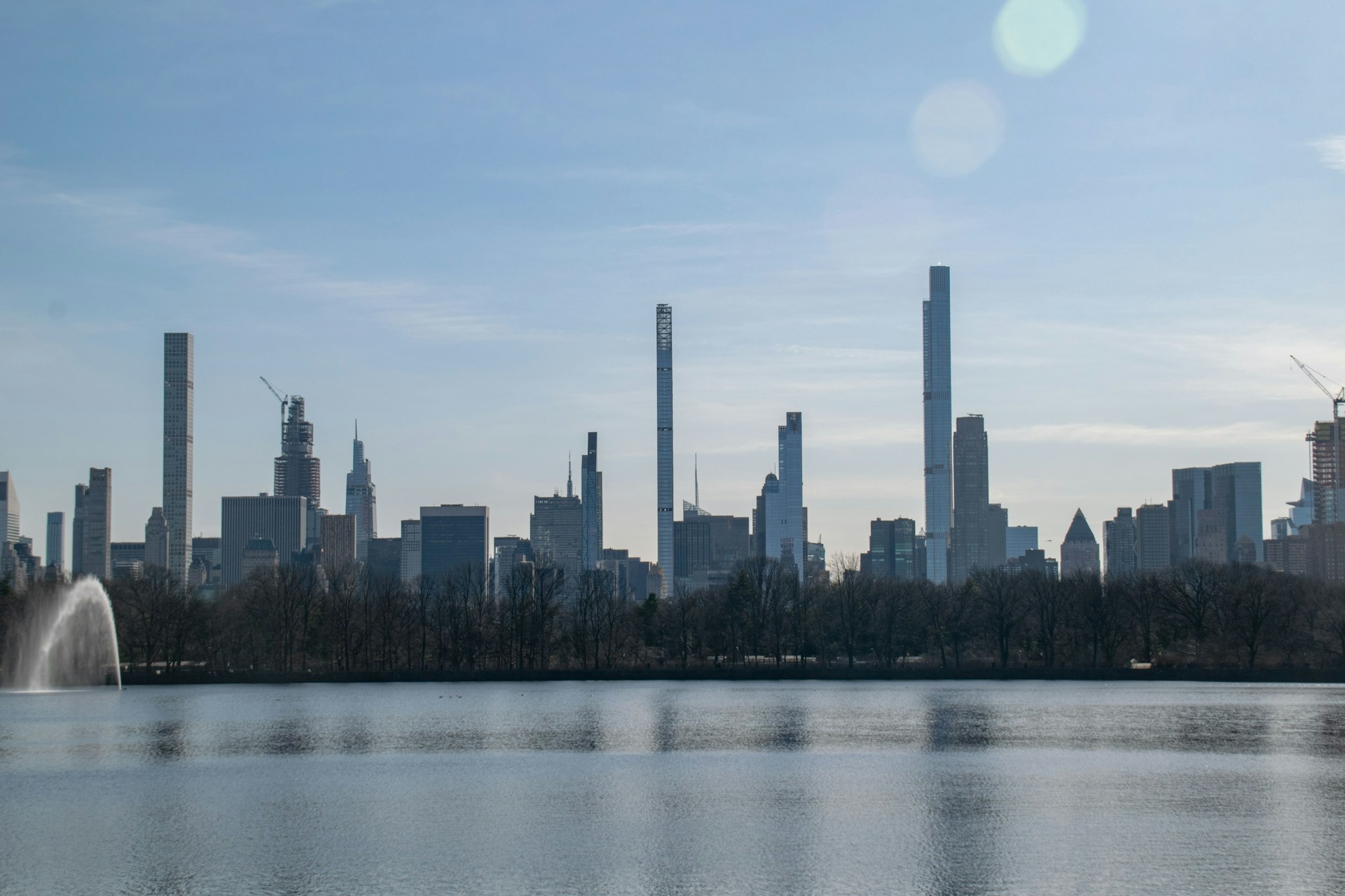 a large body of water with a city in the background