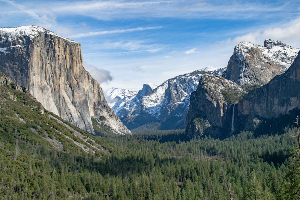 a view of a valley with mountains in the background