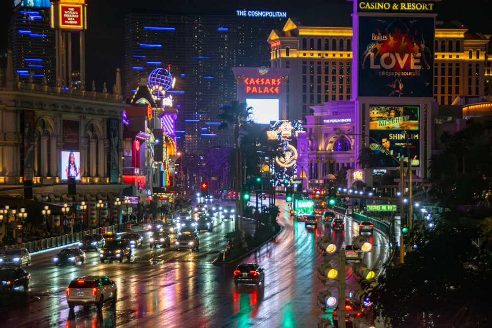 a city street filled with lots of traffic at night