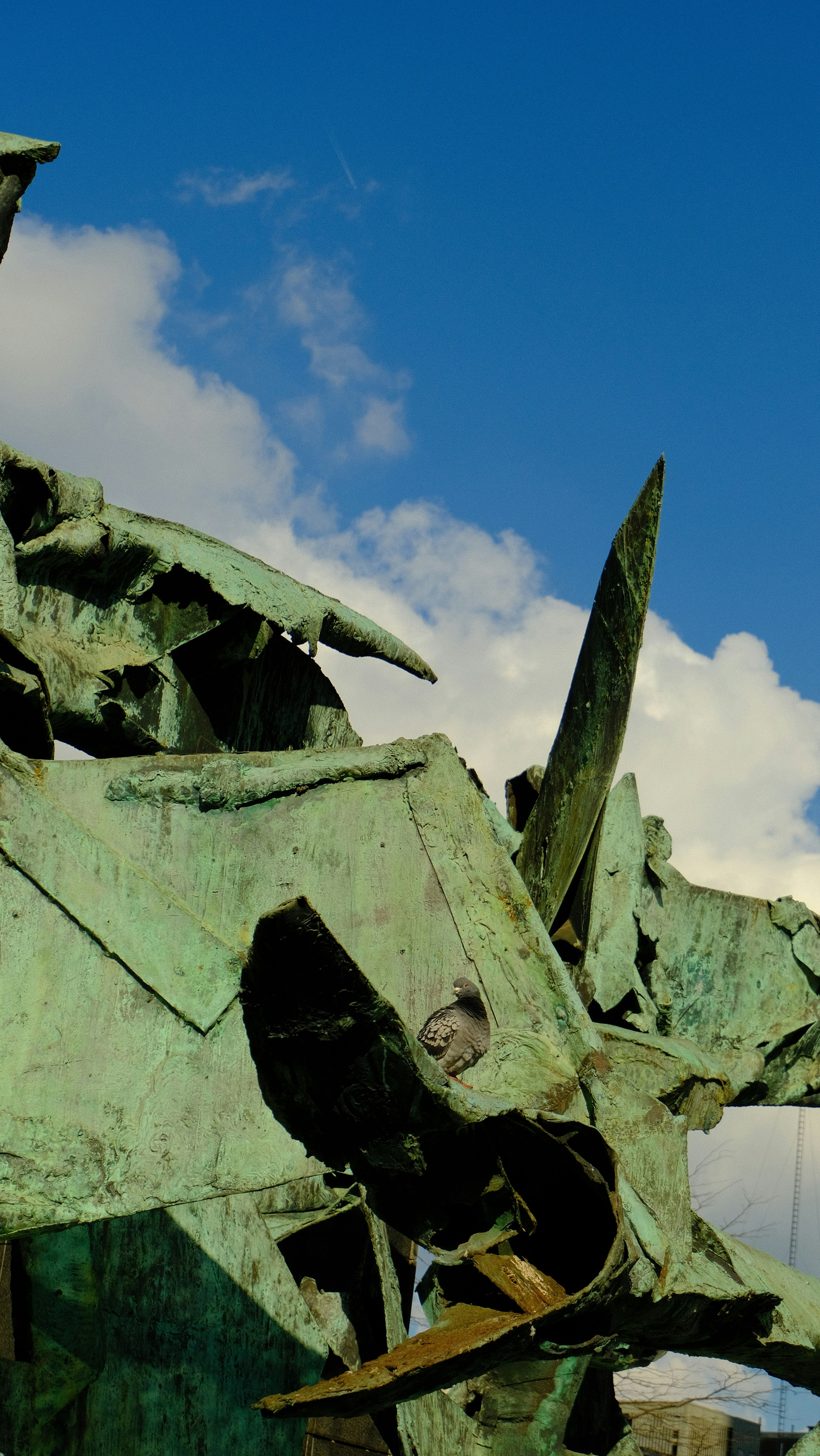 a statue of a man on a horse with a sky background