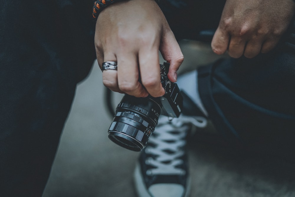 a person holding a camera in their hand