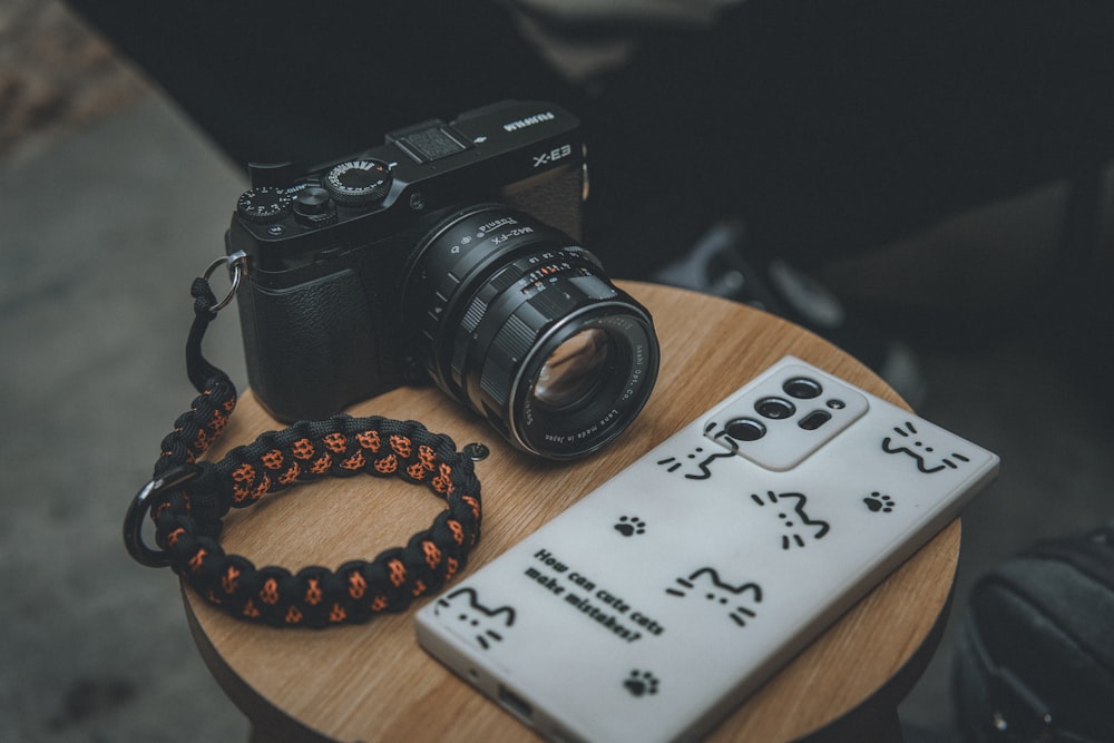 a camera sitting on top of a wooden table