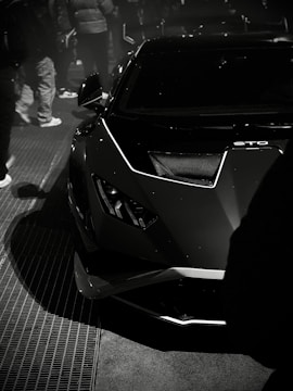 a black and white photo of a sports car