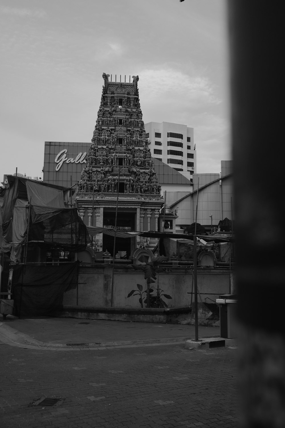 a black and white photo of a very tall building